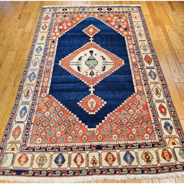 A beautifully crafted vintage Turkish Azeri rug, inspired by the iconic Serapi designs of northwestern Persia. This room-...