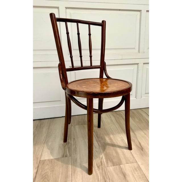 This antique bentwood chair dates to the early 20th century and is attributed to Mundus, one of the prominent Austro-...