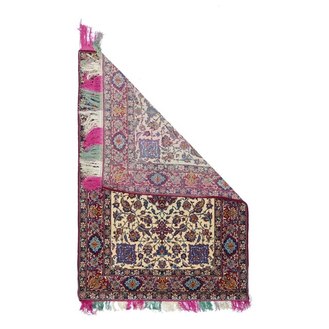 This very finely knotted central Persian city workshop small scatter shows a rainbow-colored silk warp. The palette is...