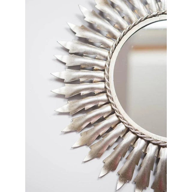 Metal with a silver finish with metal leaves of false silver bread.