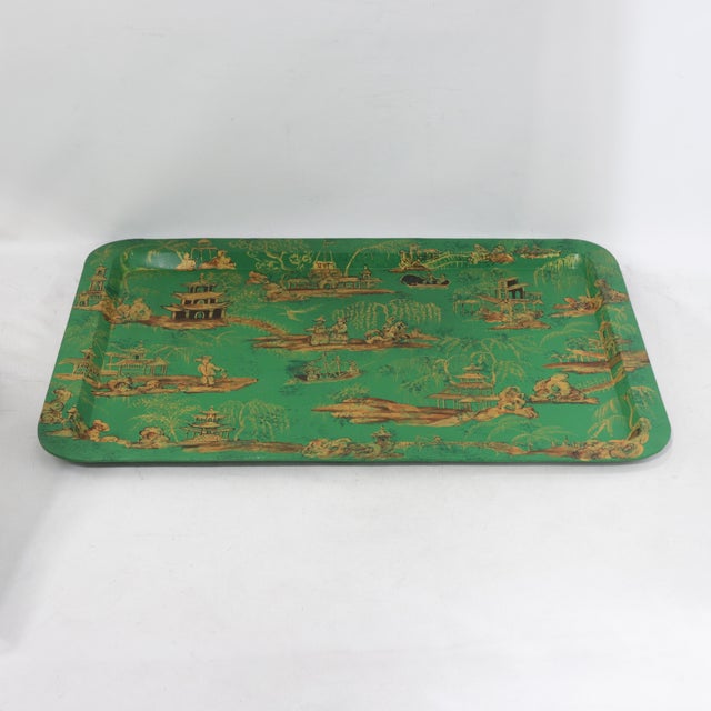 This stunning vintage hand-painted Chinoiserie tole tray features a vibrant emerald green lacquer finish adorned with an...