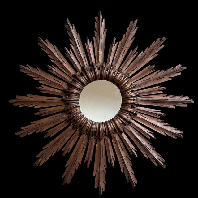 Magnificent wooden Witch Sun Mirror with central crown.