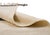 Bold abstract shapes float across an open ivory field in this artistic flatweave, where a charcoal triangle, a single...
