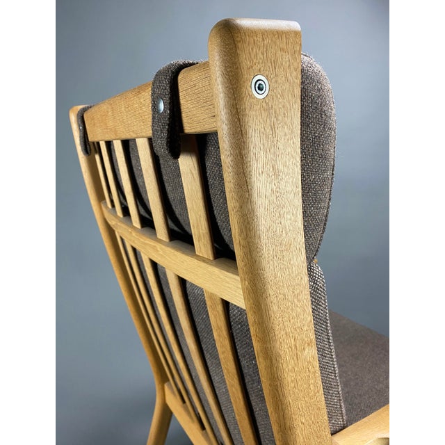 Experience timeless elegance and unparalleled comfort with the ge 265 armchair, a masterpiece of mid-century modern design...