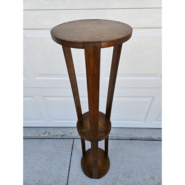 This sharp looking three-tier plant stand is 48 inches in height. The top tier and lower tier are 11 inches in diameter...