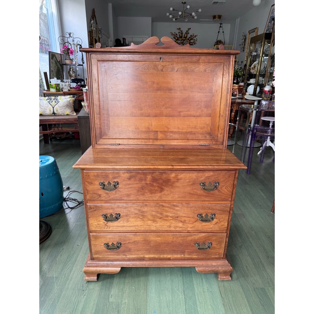 A solid cherry fall-front desk on chest from L. & J.G. Stickley's celebrated Cherry Valley collection, made in...