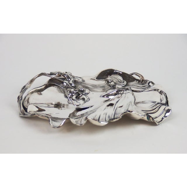 Silver metal card dish decoring women, iris and scrolls. WMF lamp. This piece has an attribution mark, I am sure that it...