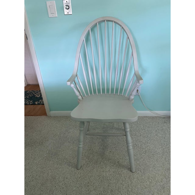 Vintage off white farmhouse-style chair with a spindle back . Farmhouse Windsor Back Arm Chair