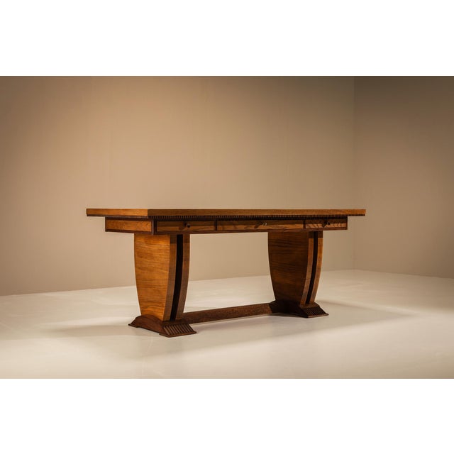 An elegant Italian desk by Pier Luigi Colli, made in Turin during the 1930s. Its geometric construction, warm wood grain...