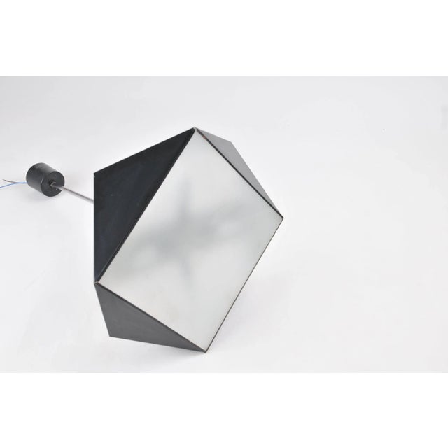 Very rare stylish mid century chandelier Napako, lacquered metal, three glass shades, four E14 light bulbs. The lamp has...