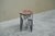 An exceptional art deco side table in hand wrought and worked iron with a richly figured red and white marble top. Europe,...