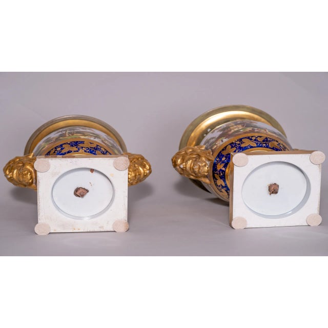 Circa 1813-1820 Pair of English Porcelain Mason Vases. These lovely vases have European God-like faces, acting as handles....