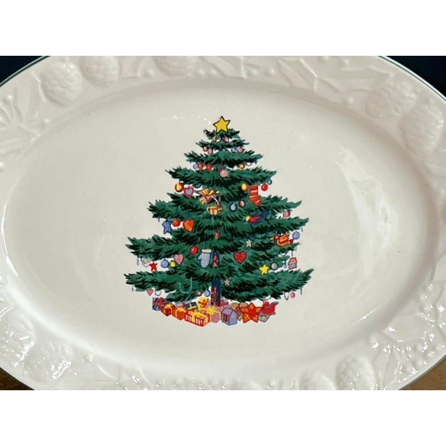 Large and durable holiday platter. Ceramic embossed with pine foliage and holly leaves, green trimmed edges The perfect...