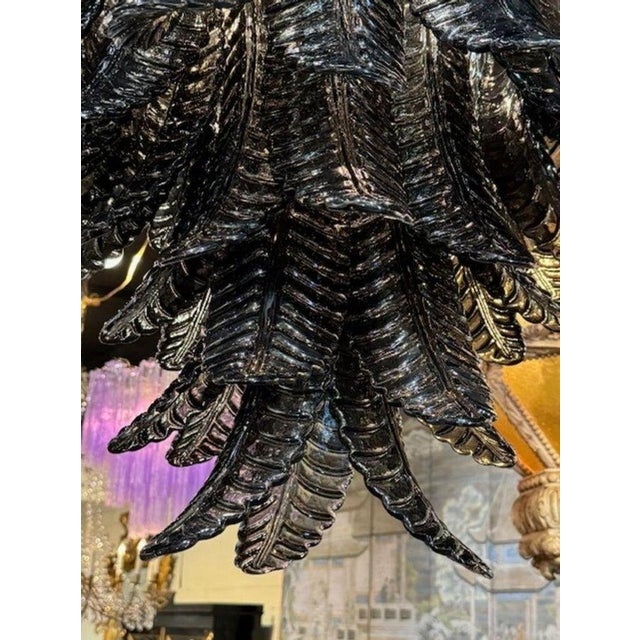 Modern Murano black glass palm leaf chandelier. Circa 2000. The chandelier has been professionally rewired, comes with...
