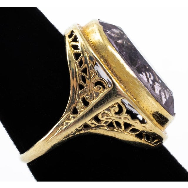 14K Yellow Gold Amethyst Ring, featuring one oval brilliant amethyst weighing approx. 15.00 carats, marked: "14K"....