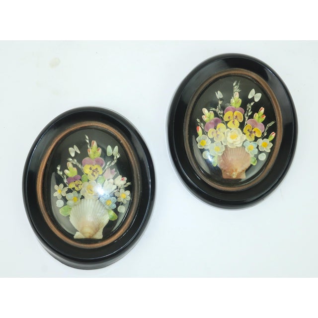 Sweet little souvenirs of the past...a pair of framed floral bouquets created with a mosaic of colored sea shells in a...