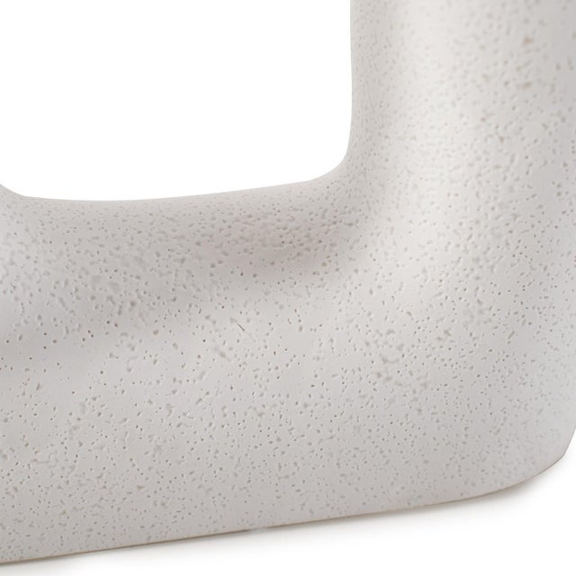 A beautifully textured vases designed to add a natural touch to the pieces. These vases is an off white color and is...
