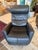 Design Plus Gallery presents a Power Swivel Recliner from Fjords. This black leather recliner has padded arms, a channel-...