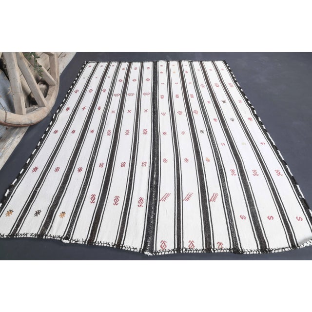 Vintage Turkish Hand-Knotted vintage rug is a semi-Vintage area kilim rug.'70s Eastern region of Turkey's unique rug is...