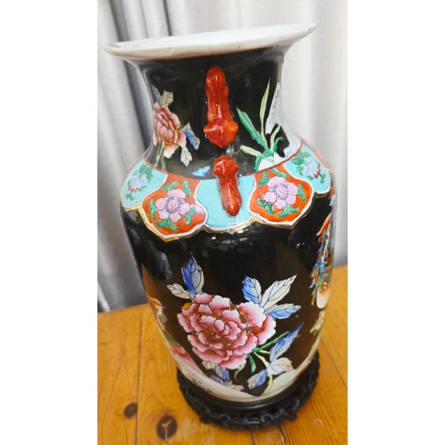 For your consideration Chinese Famille Noire porcelain baluster vase on wood Stand. On stand dimensions are 9"x9" x16"