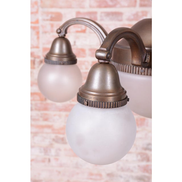 This imposing salon chandelier is a masterful example of Czechoslovak Art Deco design from the 1920s. The lighting fixture...