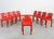 Set of nine Selene stackable chairs in red polyester reinforced with fiberglass, designed by Vico Magistretti in 1967 and...