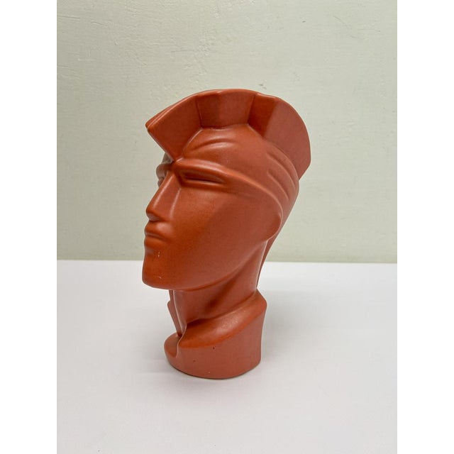 This deep-orange ceramic Postmodern head of a young man is made in the style of Lindsey B. Beautiful expressive look and...