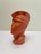 This deep-orange ceramic Postmodern head of a young man is made in the style of Lindsey B. Beautiful expressive look and...