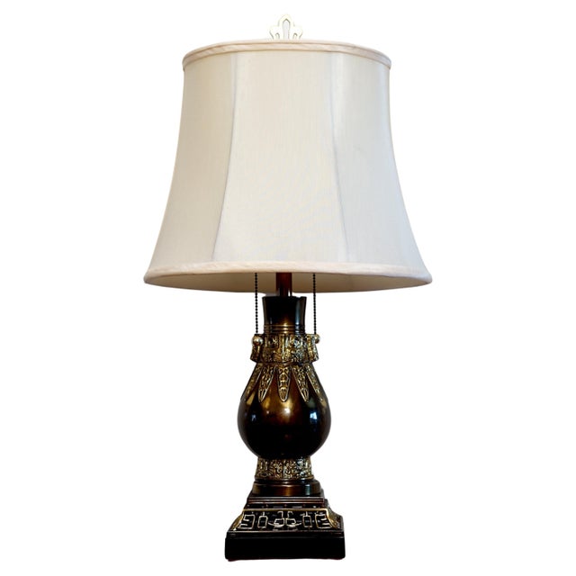 Burnished brass and double brass pulls with dual sockets speaks to the quality of craftsmanship of this Asian-influence...