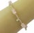 This is an authentic beaded bracelet from Tiffany & Co. It is crafted from sterling silver and has 5 translucent pink rose...