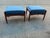 Mid century pair of ottomans. Done in a blue chenille. Walnut finish. Beautiful condition. Ready to enjoy