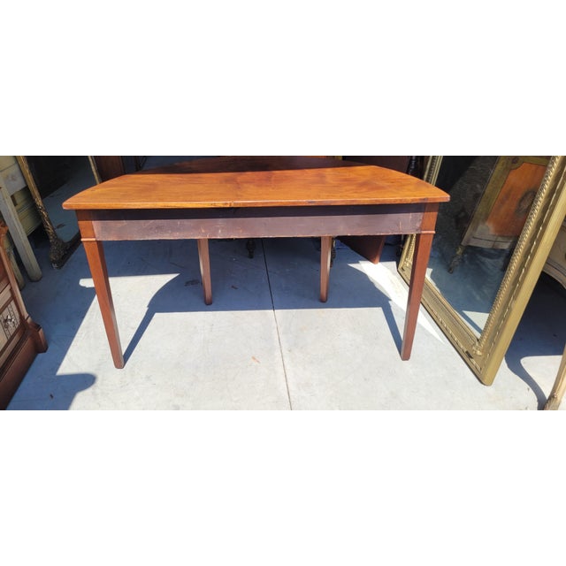 Elegant Georgian 19th century hall or side table. Features light tone mahogany wood with pin inlay, Tall Hepplewhite legs...