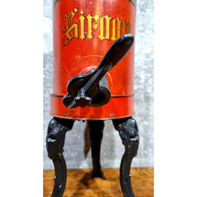 Beautiful early and rare Dutch design dispenser on a heavy cast iron base, beautiful for decoration on the floor or on a...