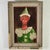 A striking yet gentle take on a circus clown (or pierrot*), in this unique and naive Folk Art painting. The young...