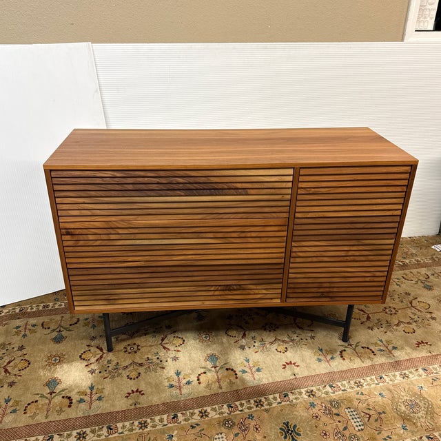 Design Plus Gallery presents the Adrain Storage Unit Sideboard from Room & Board. The storage cabinet has solid wood...