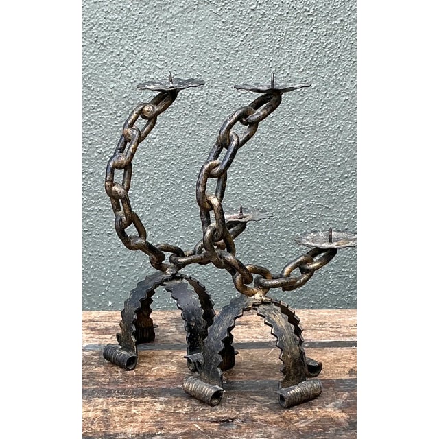 Crafted from wrought iron, these vintage chain candle holders bring a robust, rustic presence to a room. Standing 11.75...