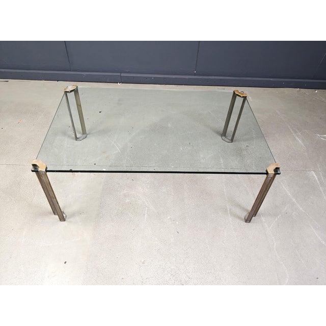T24 Pioneer rectangular coffee table made from cast brass legs designed by Peter Ghyczy. Beautiful design featuring his...