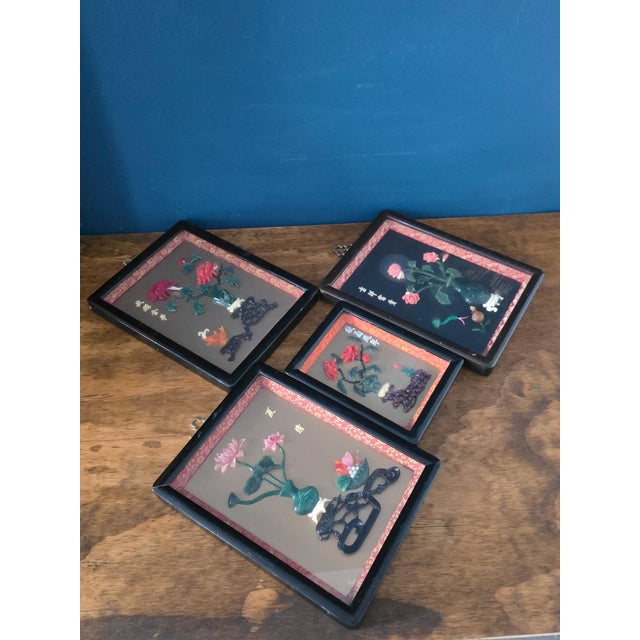 Beautiful set of four vintage Chinese-style hardstone floral panels, each showcasing intricately carved botanical...