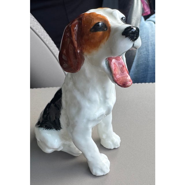 The base of the figurine is stamped with “Royal Doulton” and the inscription “Made in England,” indicating its...