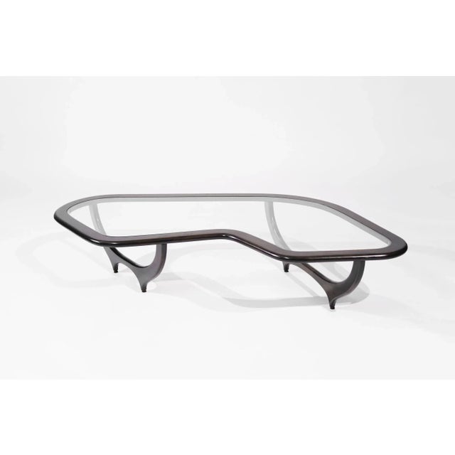 Introducing our Contour Coffee Table – a modern masterpiece inspired by Ico Parisi. Handcrafted with precision from solid...