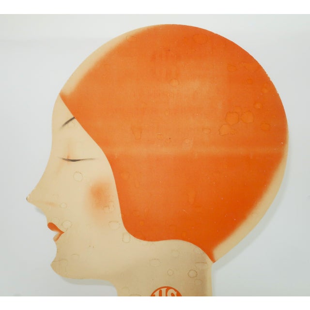 This bathing beauty is making a splash! C.1930 cardboard cut-out with art deco lithographed image of a flapper style woman...