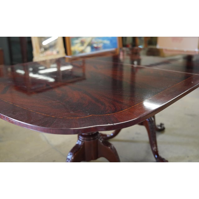 A Stunning English Regency-Satinwood-Inlaid Matchbook Flame Mahogany Dining Table with two leaves; In perfect condition....