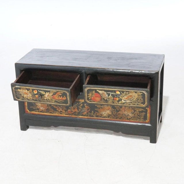 Chinese Polychrome Hand Painted Low Chest with Garden Birds & Fruit 20thC. Measures - 16.5"H x 31.75"W x 12"D.. A Chinese...