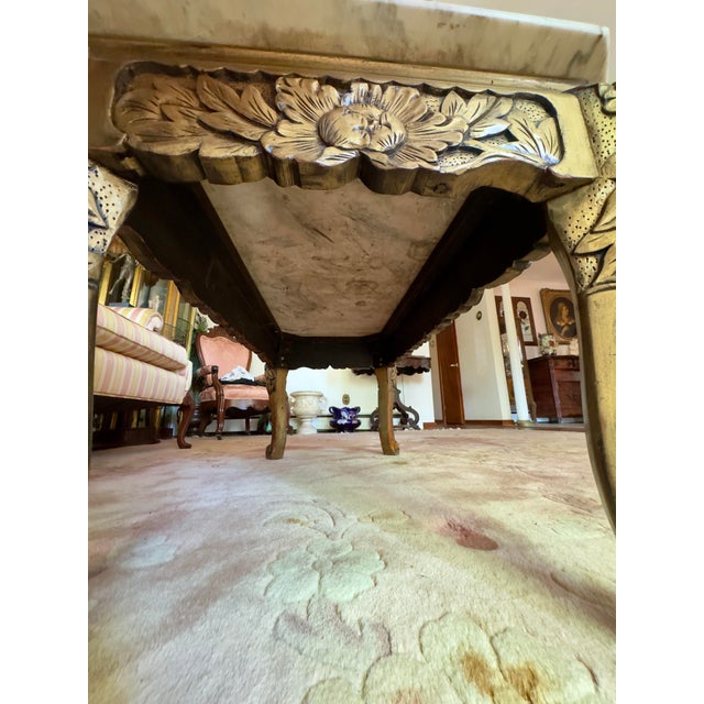 Beautiful piece for any space. A polished slab of white and gray marble with smoothed edges, wood has deep carvings of...