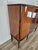 An elegant 1960s Italian display cabinet, veneered in walnut and featuring light, refined lines reminiscent of Mid-Century...