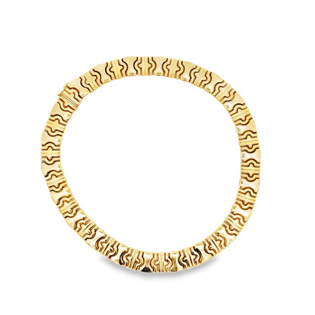 A bold vintage Italian necklace crafted in 14 karat yellow gold featuring a striking sculptural link design. The...