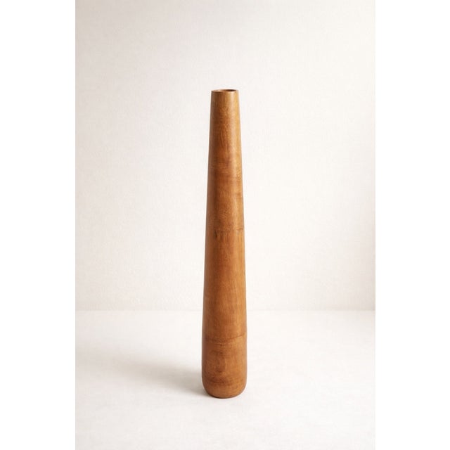 Large decorative vase made of exotic wood, with a slender and elegant design. A unique piece with beautiful natural hues,...