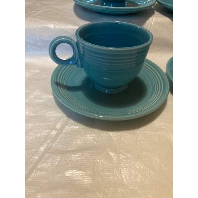 Vintage Fiesta cup and saucer set of 4. This in the color aqua and are in very good condition. 4 cups 3” 4 saucer plates 6”