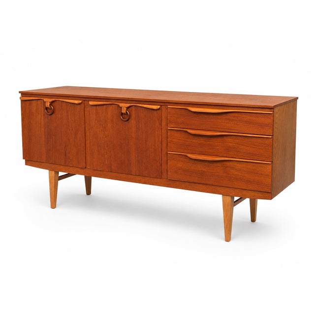 A striking and extensively restored 1960s Beautility teak sideboard, combining generous storage with some of the most...
