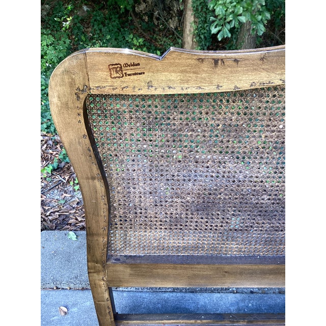 Elegant king-size headboard by Meldan Furniture, featuring an expansive woven cane panel framed in warm-toned wood. A...